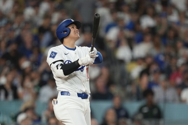 Los Angeles Dodgers' Shohei Ohtani hits a solo home run during the sixth inning of a baseball game against the New York Yankees, Friday, May 30, 2025, in Los Angeles. (AP Photo/Mark J. Terrill)