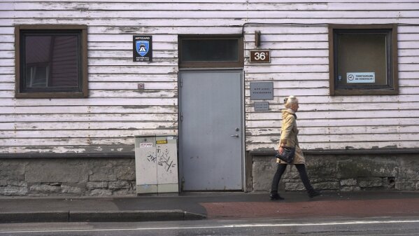 A woman walks past a methadone treatment center in Estonia's capital Tallinn on Friday, June 28, 2019. The tiny Baltic state has battled nearly two decades a fentanyl epidemic so severe its overdose death rate was almost six times the European average. Although police won the war on fentanyl the market shifted further towards synthetic drugs. (AP Photo/David Keyton)