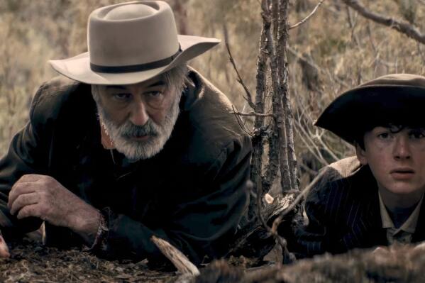 This image released by Falling Forward Films shows Alec Baldwin, left, and Patrick Scott McDermott in a scene from "Rust." (Falling Forward Films via AP)