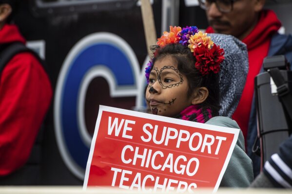 Educators, students, and union laborers rally at Union Park during the Chicago Teachers Union strike Saturday, Oct. 26, 2019, in Chicago. (Tyler LaRiviere/Chicago Sun-Times via AP)
