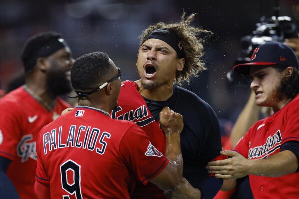 Cleveland Guardians' Josh Naylor, center, celebrates with Richie Palacios and Eli Morgan after hitting a game-ending, two-run home run during the 10th inning against the Minnesota Twins in a baseball game Wednesday, June 29, 2022, in Cleveland. (AP Photo/Ron Schwane)