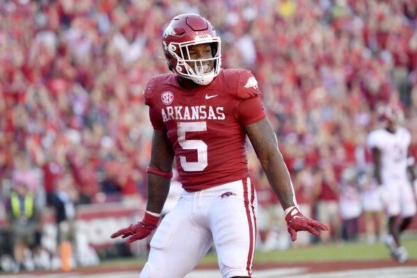 FILE - Arkansas running back Raheim Sanders (5) celebrates after a touchdown against Alabama during an NCAA college football game Saturday, Oct. 1, 2022, in Fayetteville, Ark. Arkansas opens their season at home against Western Carolina on Sept. 2. (AP Photo/Michael Woods, File)