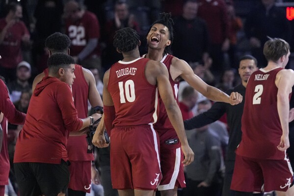 Alabama forward Jarin Stevenson (15) and Alabama forward Mouhamed Dioubate (10) clebrate after defeating Georgia in an NCAA college basketball game Wednesday, Jan. 31, 2024, in Athens, Ga. (AP Photo/John Bazemore)