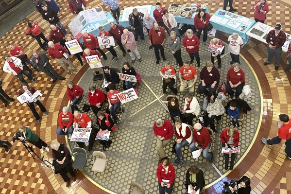 Opponents of Summit Carbon Solutions' proposed carbon dioxide pipeline gather at the state Capitol in Des Moines, Iowa, on Feb. 8, 2024. (AP Photo/Hannah Fingerhut, File)