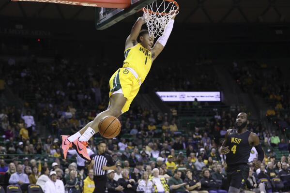 Baylor guard Keyonte George scores against Norfolk State guard Joe Bryant Jr. in the first half of an NCAA college basketball game, Friday, Nov. 11, 2022, in Waco, Texas. (AP Photo/Jerry Larson)