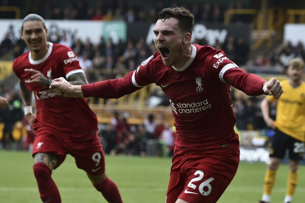 Liverpool's Andrew Robertson celebrates after scoring his side's second goal during the English Premier League soccer match between Wolverhampton and Liverpool at the Molineux stadium in Wolverhampton, England, Saturday, Sept. 16, 2023. (AP Photo/Rui Vieira)