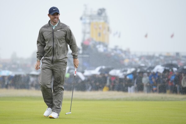 Northern Ireland's Rory McIlroy reacts after putting on the 1st green during the final day of the British Open Golf Championships at the Royal Liverpool Golf Club in Hoylake, England, Sunday, July 23, 2023. (AP Photo/Jon Super)