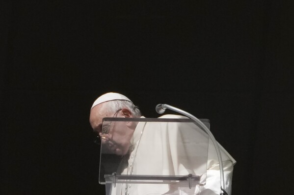 Pope Francis leaves his studios window at the end of the Angelus noon prayer in St. Peter's Square at the Vatican, Sunday, Nov. 5, 2023. (AP Photo/Gregorio Borgia)