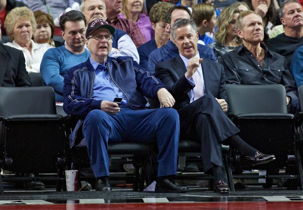 
              FILE - In this Jan. 10, 2016 file photo, Portland Trail Blazers owner Paul Allen, left, and general manager Neil Olshey appear during the second half of an NBA basketball game in Portland, Ore. Allen, billionaire owner of the Trail Blazers and the Seattle Seahawks and Microsoft co-founder, died Monday, Oct. 15, 2018 at age 65. Earlier this month Allen said the cancer he was treated for in 2009, non-Hodgkin’s lymphoma, had returned.  (AP Photo/Craig Mitchelldyer, File)
            