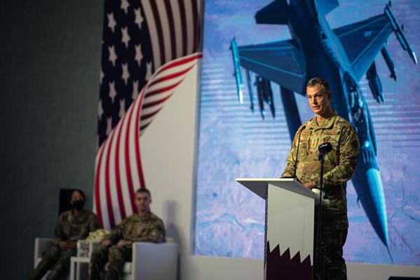 This image provided by the U.S. Air Force shows U.S. Air Force Lt. Gen. Alexus G. Grynkewich, incoming Ninth Air Force (Air Forces Central) commander, delivering a commemorative speech during a change of command ceremony at al-Udeid Air Base, Qatar, Thursday, July 21, 2022. The top U.S. Air Force general in the Middle East has warned that Iran-backed militias could resume attacks in the region against the United States and its allies. Lt. Gen. Grynkewich spoke to journalists before stepping into his new role. (Staff Sgt. Draeke Layman/U.S. Air Force via AP)