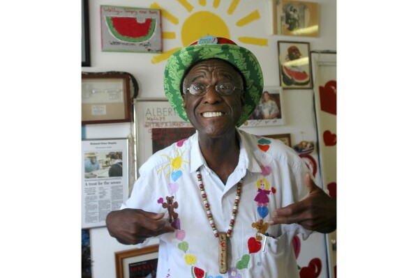 FILE - Wally Amos, of Kailua, Hawaii, is shown in his home office June 12, 2007, in the Lanikai section of Kailua, Hawaii. Amos, the creator of the cookie empire that took his name and made it famous and who went on to become a children's literacy advocate, has died at age 88, on Tuesday, Aug. 13, 2024. (AP Photo/Lucy Pemoni, File)