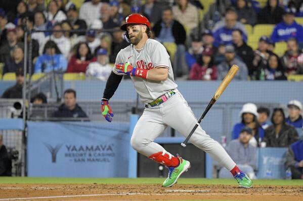Philadelphia Phillies' Bryce Harper heads to first as he grounds out during the fourth inning of a baseball game against the Los Angeles Dodgers Tuesday, May 2, 2023, in Los Angeles. (AP Photo/Mark J. Terrill)