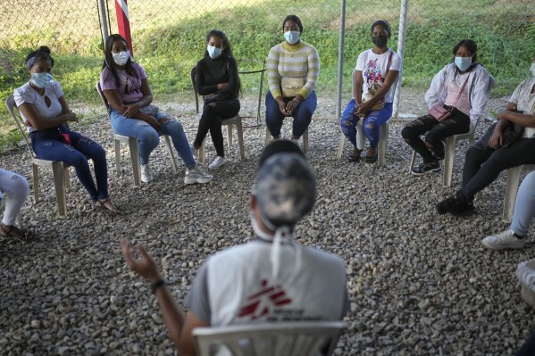 A community health worker teaches a group of women and teenage girls about contraception methods, at a Doctors Without Borders medical clinic, in Putucual, Venezuela, Wednesday, Jan. 10, 2024. The health worker also asked what they knew about HPV. (AP Photo/Matias Delacroix)