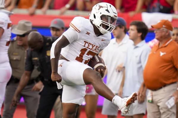 Texas running back Savion Red reacts after running for a first down during the second half of an NCAA college football game against Houston, Saturday, Oct. 21, 2023, in Houston. (AP Photo/Eric Christian Smith)
