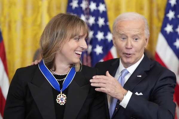 President Joe Biden awards the nation's highest civilian honor, the Presidential Medal of Freedom, to Katie Ledecky during a ceremony in the East Room of the White House, Friday, May 3, 2024, in Washington. (AP Photo/Alex Brandon)