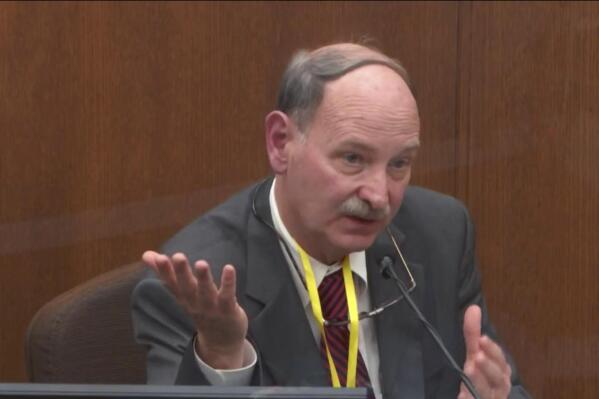 FILE - In this image from video, Dr. Bill Smock, a Louisville physician in forensic medicine, testifies in the trial of former Minneapolis police Officer Derek Chauvin, charged in the 2020 death of George Floyd, at the Hennepin County Courthouse in Minneapolis, Minn., on Thursday, April 8, 2021. Smock testified that he believes excited delirium is real. But he said Floyd met none of the 10 criteria developed by the American College of Emergency Physicians. In a statement posted on the National Association of Medical Examiners’ site on March 23, 2023, the leading group of medical experts says the term “excited delirium”should not be listed as a cause of death. Critics have said the term has been used to justify excessive force by police. (Court TV via AP, Pool)