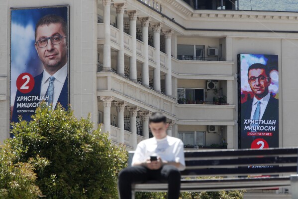 Giant portraits of Hristijan Mickoski, the leader of the center-right main opposition VMRO-DPMNE party, are displayed on a building in Skopje, North Macedonia, on Monday, May 6, 2024. Voters go to the polls on Wednesday in North Macedonia to cast ballots for parliamentary election and presidential runoff, for the second time in two weeks. (AP Photo/Boris Grdanoski)