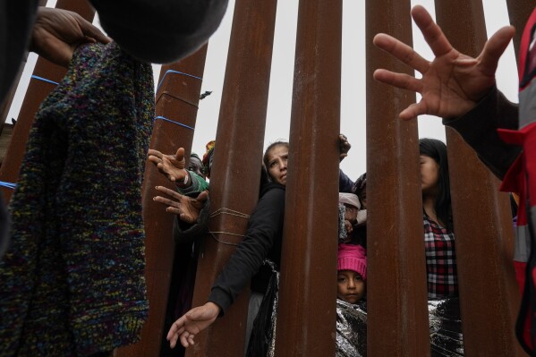 An AP photographer covers the migrant crisis at the border with sensitivity and compassion