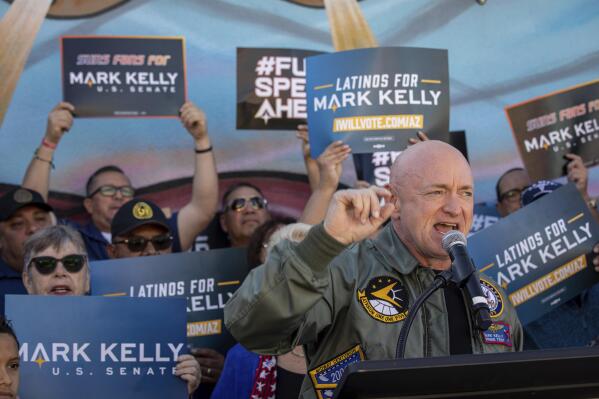 Sen. Mark Kelly, D-Ariz., speaks to supporters at the Barrio Cafe in Phoenix, Saturday, Nov. 12, 2022. (AP Photo/Alberto Mariani)