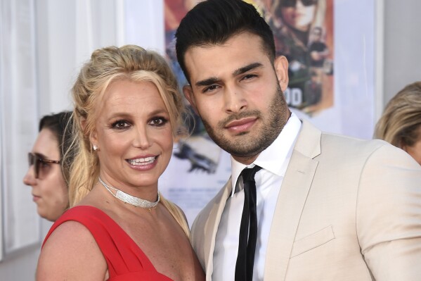 FILE - Britney Spears and Sam Asghari appear at the Los Angeles premiere of "Once Upon a Time in Hollywood" on July 22, 2019. Asghari has filed for divorce from Spears, a person familiar with the filing said late Wednesday, Aug. 16, 2023. The person, who is close to Asghari but not authorized to speak publicly, confirmed the filing happened Wednesday, hours after several outlets including TMZ and People magazine reported the couple had separated. (Photo by Jordan Strauss/Invision/AP, File)