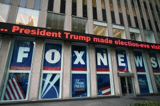 FILE - A headline about President Donald Trump is displayed outside Fox News studios in New York on Nov. 28, 2018. (AP Photo/Mark Lennihan, File)