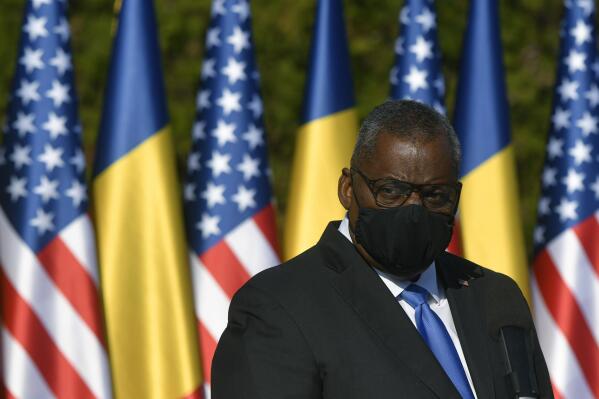 U.S. Defense Secretary Lloyd Austin stands during a joint press conference with Romanian Defense Minister Nicolae Ciuca during a welcoming ceremony in Bucharest, Romania, Wednesday, Oct. 20, 2021. Austin is visiting Romania before attending the NATO Defense Ministerial in Brussels.  (AP Photo/Andreea Alexandru)