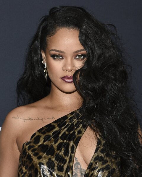 FILE - Singer and fashion designer Rihanna attends the "Rihanna" book launch event in New York on Oct. 11, 2019. It's been four years since Rihanna released an album but the singer is working hard on recording new music. The pop star, 32, told The Associated Press for her new album she's already held “tons of writing camps" — where songwriters are put into groups to create original tracks for artists. (Photo by Evan Agostini/Invision/AP, File)