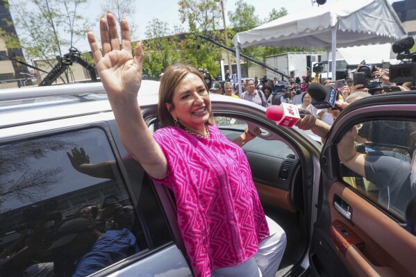 Opposition presidential candidate Xóchitl Gálvez waves as she leaves a polling station after voting in the general election, in Mexico City, Sunday, June 2, 2024. (AP Photo/Fernando Llano)