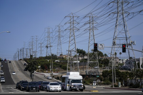 Power transmission towers line a street in Redondo Beach, Calif., Wednesday, Sept. 7, 2022. (AP Photo/Jae C. Hong, File)
