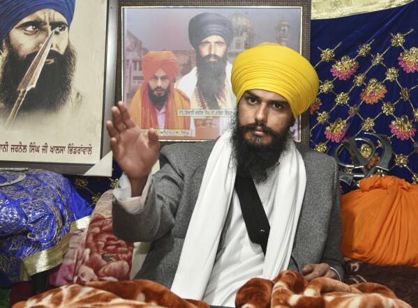 FILE - Sikh separatist leader and head of Waris Punjab De, or Punjab's Heirs, Amritpal Singh, talks to his supporters in the village Jallupur Khera, near Amritsar, India, on Jan.7, 2023. Earlier this year, Indian police arrested the separatist leader who had revived calls for Khalistan and stirred fears of violence in Punjab. (AP Photo/Prabhjot Gill, File)