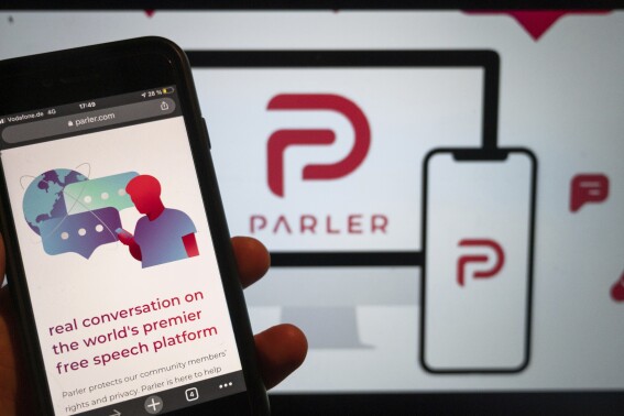 FILE - The website for the social media platform Parler is seen, Jan. 10, 2021, in Berlin. The social media platform Parler, which caters to right-wing voices and was temporarily booted offline following the Jan. 6, 2021, insurrection, is relaunching ahead of the 2024 presidential elections. (Christophe Gateau/dpa via AP, File)