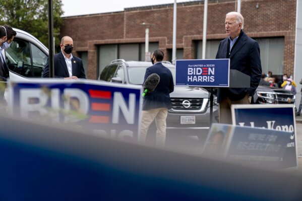 Democratic presidential candidate former Vice President Joe Biden speaks to amember of the media outside a voter service center, Monday, Oct. 26, 2020, in Chester, Pa. (AP Photo/Andrew Harnik)