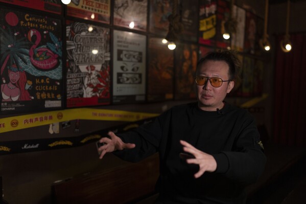 Liu Fei, the owner of School Bar, speaks during an interview in Beijing, Saturday, Feb. 15, 2025. (AP Photo/Ng Han Guan)