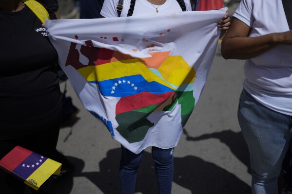 With patriotic reggaeton and videos, Venezuela's government fans territorial  dispute with Guyana | AP News