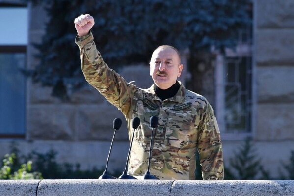 In this photo provided by the Azerbaijan's Presidential Press Office, Azerbaijani President Ilham Aliyev delivers his message during a parade dedicated to the third anniversary of the Victory in the Patriotic War in Khankendi, also known by Armenians as Stepanakert, in Nagorno-Karabakh, Wednesday, Nov. 8, 2023. Azerbaijanis celebrate the third anniversary of their victory in the 2020 Nagorno-Karabakh war after Azerbaijan gained the full control over the separatist region in fighting earlier this year. (Azerbaijani Presidential Press Office via AP)