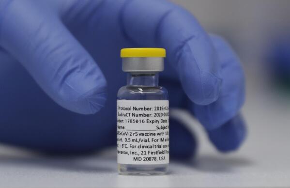 FILE - In this Wednesday, Oct. 7, 2020, file photo, a vial of the Phase 3 Novavax coronavirus vaccine is seen ready for use in the trial at St. George's University hospital in London. Novavax says its vaccine appears effective against COVID-19 in a large study, including against variants. Results from the study in the U.S. and Mexico were released on Monday, June 14, 2021. (AP Photo/Alastair Grant, File)