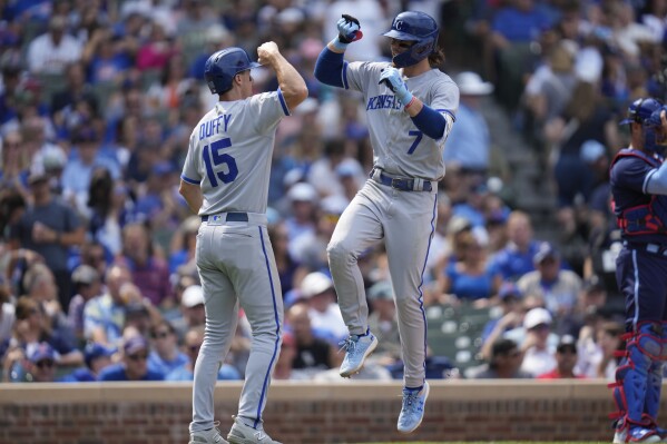 Kansas City Royals' Bobby Witt Jr., right, jumps up to celebrate his home run with Matt Duffy during the sixth inning of a baseball game against the Chicago Cubs, Friday, Aug. 18, 2023, in Chicago. (AP Photo/Erin Hooley)