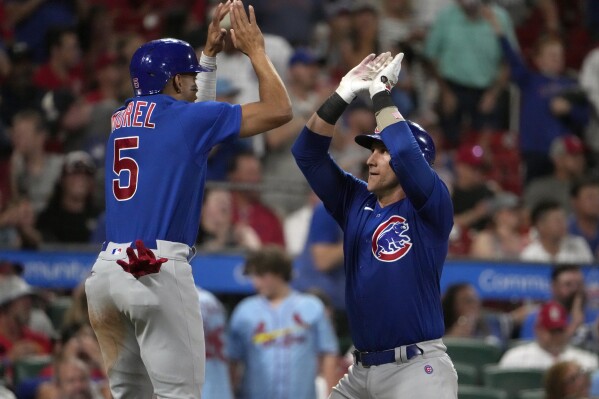 Chicago Cubs' Yan Gomes, right, is congratulated by teammate Christopher Morel (5) after hitting a two-run home run during the fourth inning of a baseball game against the St. Louis Cardinals Saturday, July 29, 2023, in St. Louis. (AP Photo/Jeff Roberson)