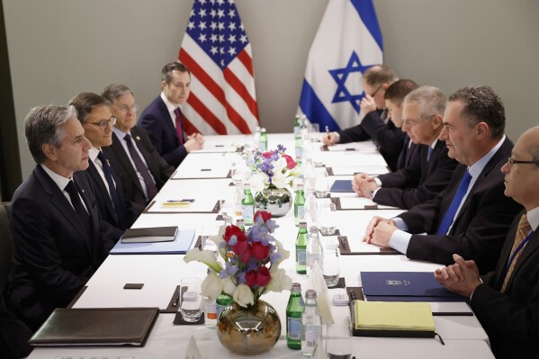 U.S. Secretary of State Antony Blinken, left, attends a meeting with Israel's Foreign Minister Israel Katz, second right, in Tel Aviv, Israel, Tuesday, Jan. 9, 2024, as part of his week-long trip aimed at calming tensions across the Middle East. (Evelyn Hockstein/Pool Photo via AP)