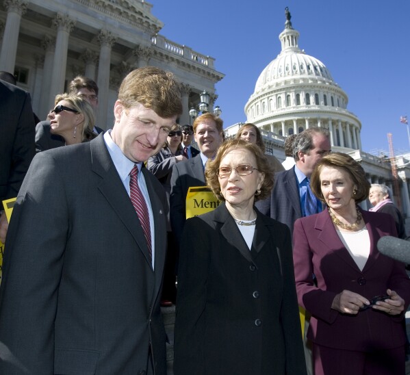 FILE - So-Rep.  Patrick Kennedy, D-Calif., left, former first lady Rosalynn Carter, center, and then-House Speaker Nancy Pelosi, D-Calif., participate in a rally to discuss bipartisan health care parity legislation mental health, March 5, 2008. Capitol in Washington.  Health care experts say the advocacy of Carter, who died Sunday, Nov. 19, 2023, at the age of 96, created a framework for much of the progress on mental illness in America.  (AP Photo/Manuel Balce Ceneta, file)