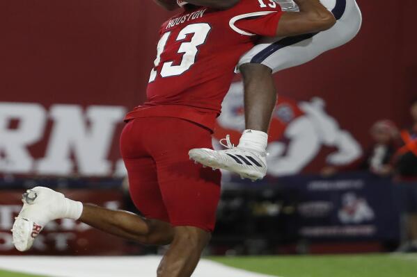 Nevada wide receiver Romeo Doubs catches a two-point conversion-try as he is pushed out of bounds by Fresno State defensive back Justin Houston to end the second half of an NCAA college football game in Fresno, Calif., Saturday, Oct. 23, 2021. The catch was ruled out of bounds. (AP Photo/Gary Kazanjian)
