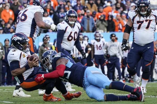 Wilson sacked 6 times, picked off late as Denver loses again