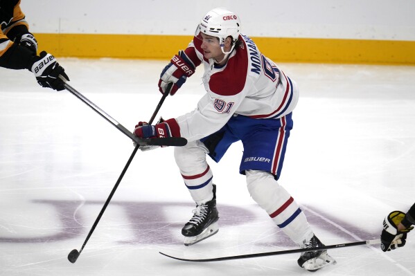FILE - Montreal Canadiens' Sean Monahan (91) skates during the first period of an NHL hockey game against the Pittsburgh Penguins in Pittsburgh, Saturday, Jan. 27, 2024. The Winnipeg Jets acquired Sean Monahan in a trade Friday, Feb. 2, 2024, with the Montreal Canadiens, giving one of the top Stanley Cup contenders in the Western Conference more depth at center for a potential playoff run.(AP Photo/Gene J. Puskar, File)