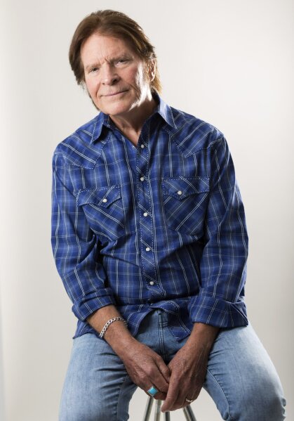 In this Tuesday, Aug. 6, 2019 photo, John Fogerty poses for a photo at an interview with The Associated Press in New York. For the first time, an audio recording is available of nearly everything heard onstage at Woodstock 50 years ago - from transcendent music to announcements about lost people and bad acid. Creedence Clearwater Revival, one of the most popular acts at the time, had never before authorized release of their performance. Fifty years later, the set is now available both on the Rhino Records box and a separate disc okayed by Fogerty. (Photo by Brian Ach/Invision/AP)