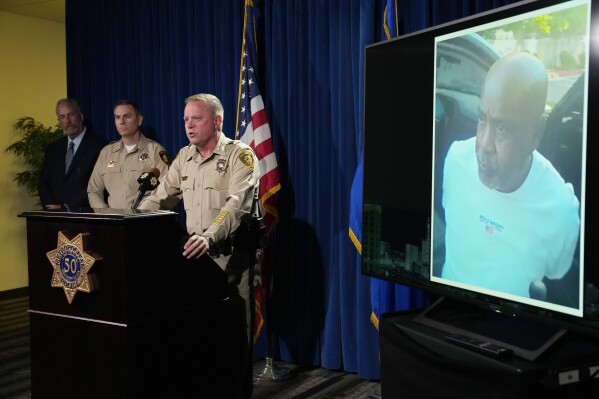 Las Vegas Sheriff Kevin McMahill speaks beside a photo of Duane "Keefe D" Davis during a news conference on an indictment in the 1996 murder of rapper Tupac Shakur, Friday, Sept. 29, 2023, in Las Vegas. (AP Photo/John Locher)