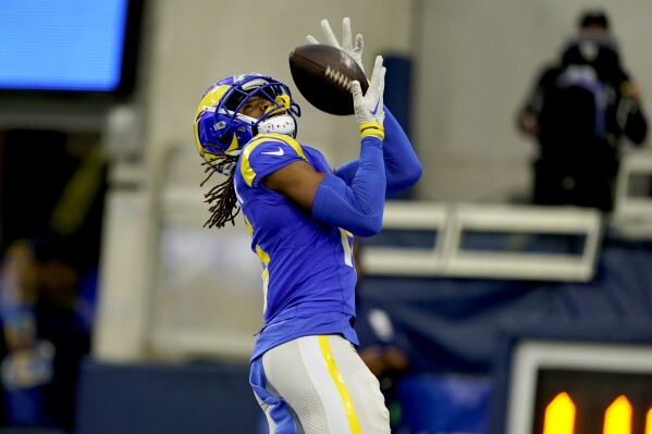 Los Angeles Rams wide receiver Demarcus Robinson (15) catches a pass for a touchdown during the second half of an NFL football game against the Washington Commanders Sunday, Dec. 17, 2023, in Los Angeles. (AP Photo/Ryan Sun)