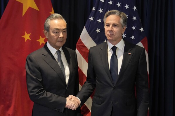 U.S. Secretary of State Antony Blinken, right, shakes hands with Chinese Communist Party's foreign policy chief Wang Yi during their bilateral meeting on the sidelines of the Association of Southeast Asian Nations (ASEAN) Foreign Ministers' Meeting in Jakarta, Indonesia, Thursday, July 13, 2023. (AP Photo/Dita Alangkara, Pool)