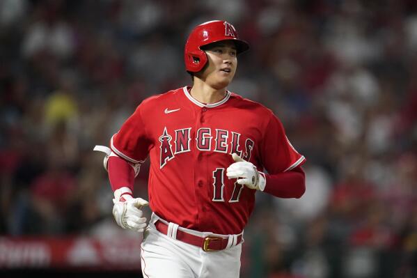 Angels blow late lead before beating Tigers in 10th