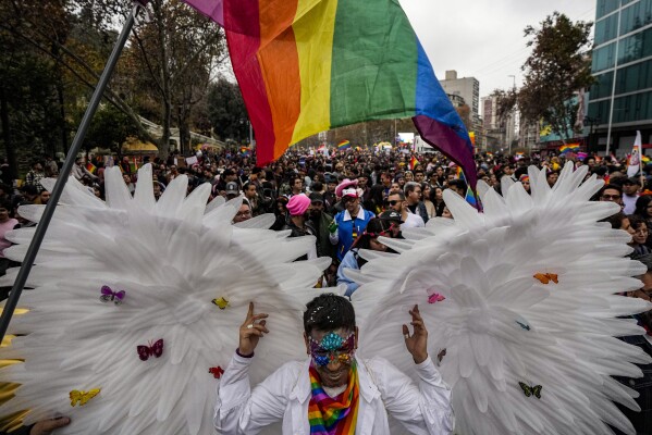 People participate in the annual Pride march in Santiago, Chile, Sunday, June 25, 2023. (AP Photo/Esteban Felix)