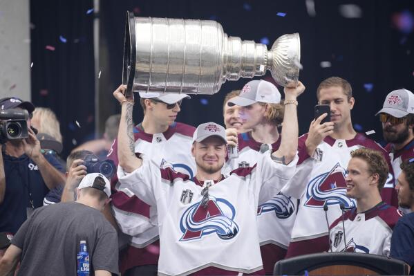 Colorado Avalanche right wing Valeri Nichushkin lifts the Stanley Cup during a rally outside the City/County Building for the NHL hockey champions after a parade through the streets of downtown Denver, Thursday, June 30, 2022. (AP Photo/David Zalubowski)